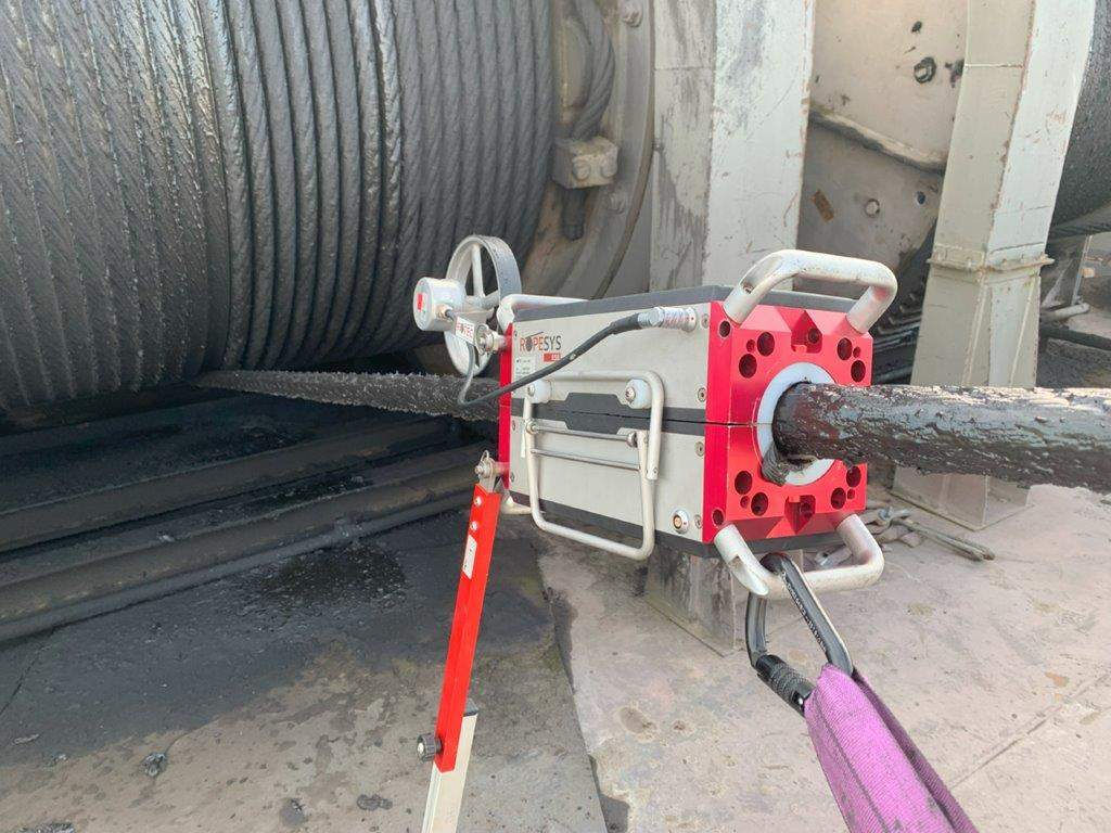 NDT machine running a test on a spool of wire rope