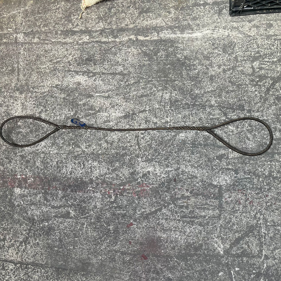 wire rope sling laid on the floor with the entire sling visible
