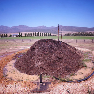 A mound of dirt rises up above the ground for geothermal power