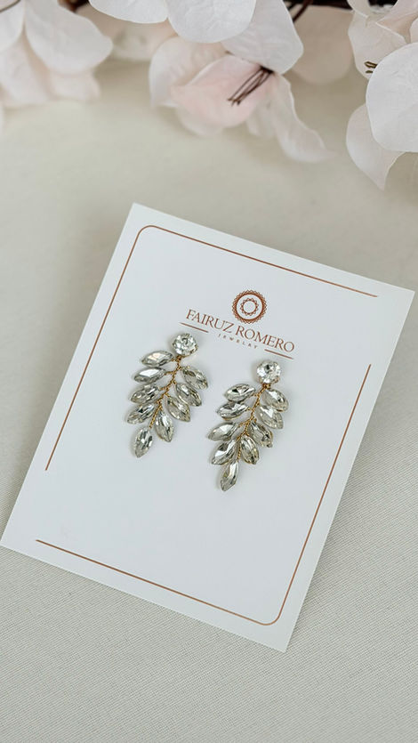 Aretes Palma de Fairuz Romero Jewelry con cristales y base dorada