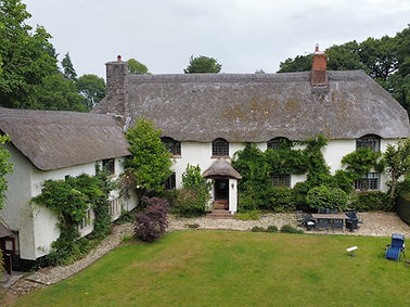 Heritage appraisal and heritage impact assessment for proposed development within the grounds of a grade I listed 14th century hall house in Devon.