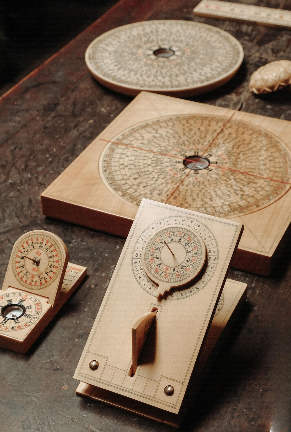 Traditional Feng Shui compass and reference tools used for spatial orientation