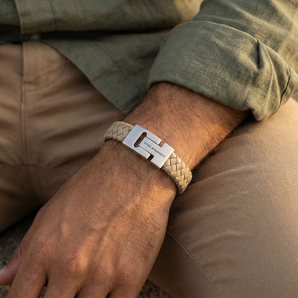 a model wearing a cream braided men's bracelet