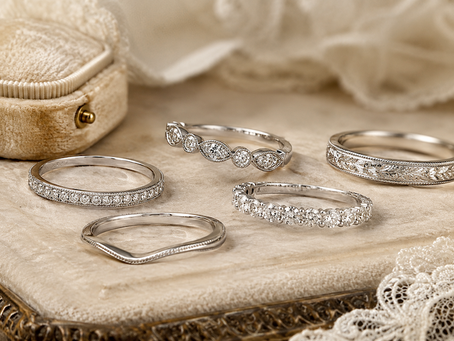 A range of vintage rings all in white gold and platinum on a velvet presentation surface