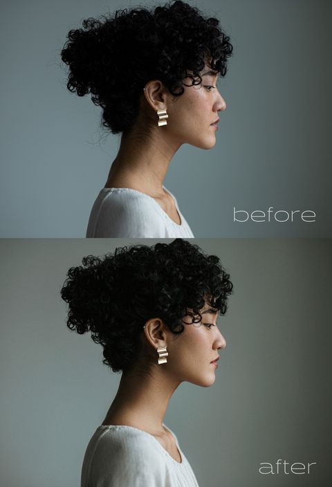 A woman with elegant up-do and white blouse.