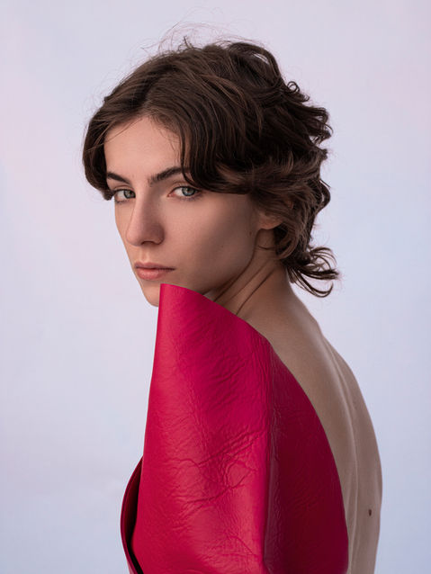 Woman without makeup in pink leather.