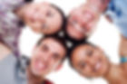 4 students heads together.jpg