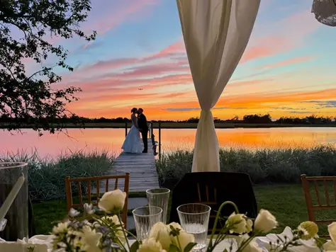  bride and groom exchanged vows beneath a sky that eventually produced the most spectacular sunset.