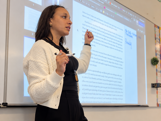 Engaged Teacher Presenting Classroom Lesson.png