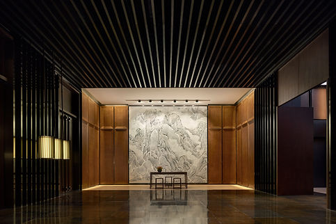 Hall with black roof and walls and white artwork at the background