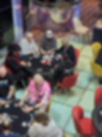 Players seated around the poker table during a sea day tournament — poker cruise holidays South Paci