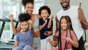 A family with 3 children being active and exercising together
