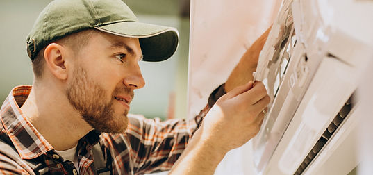 repairman-doing-air-conditioner-service.jpg