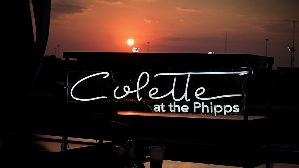 Neon sign that reads "Colette at the Phipps"