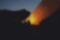 silhouette photo of people sitting near orange cover_edited.jpg