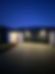 A newly built house illuminated by outdoor lights installed by Frew Electrical. The well-placed lighting fixtures accentuate the home's architectural features and provide enhanced security and visibility. The modern, energy-efficient lights create a welcoming and stylish ambiance, demonstrating Frew Electrical's expertise in exterior lighting solutions for new residential constructions.