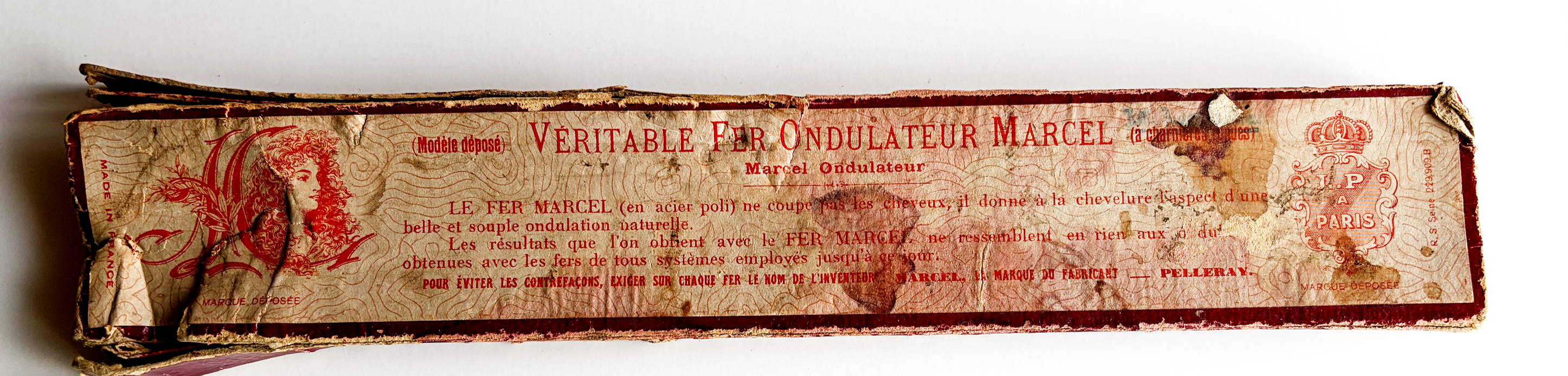 Historical French packaging for a Marcel ondulation iron, front