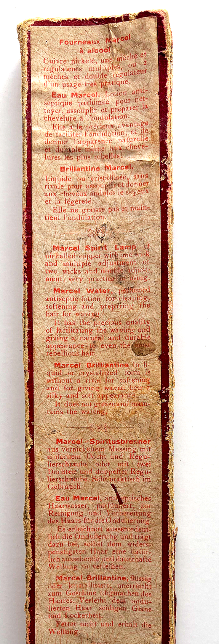 Back of historical Marcel ondulation iron packaging showing multilingual printed instructions