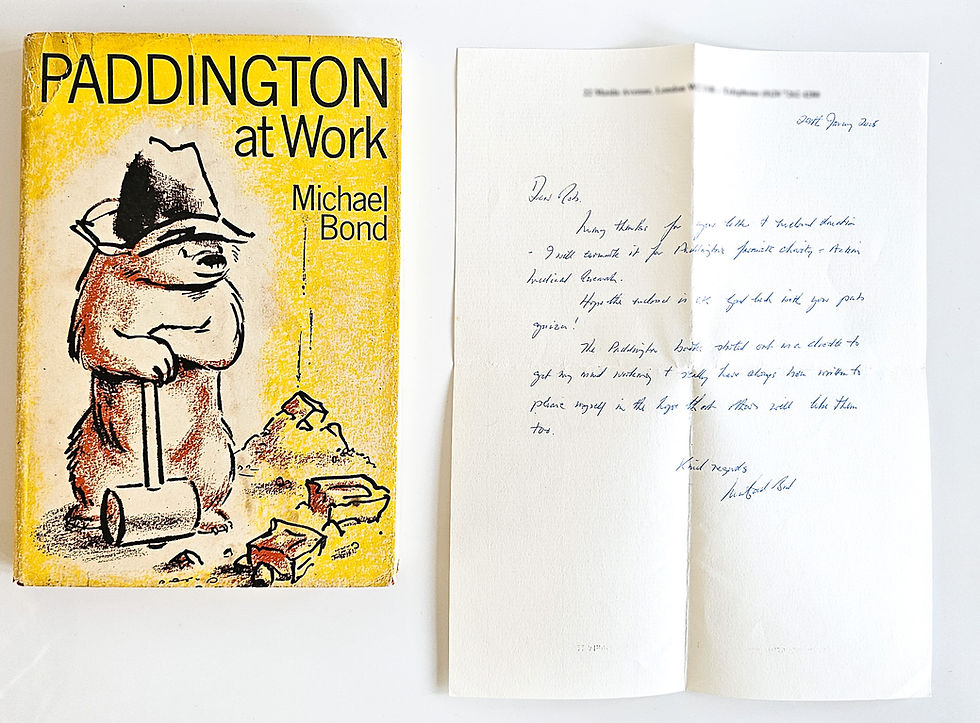 Paddington at Work first edition beside the autograph letter signed by Michael Bond on his letterhead