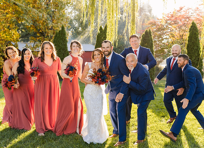 The Barn at Murphey Farm wedding party picture beside willow tree with sunset
