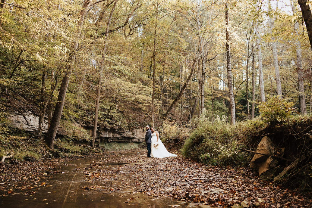 The Barn at Murphey Farm  put couple by the creek