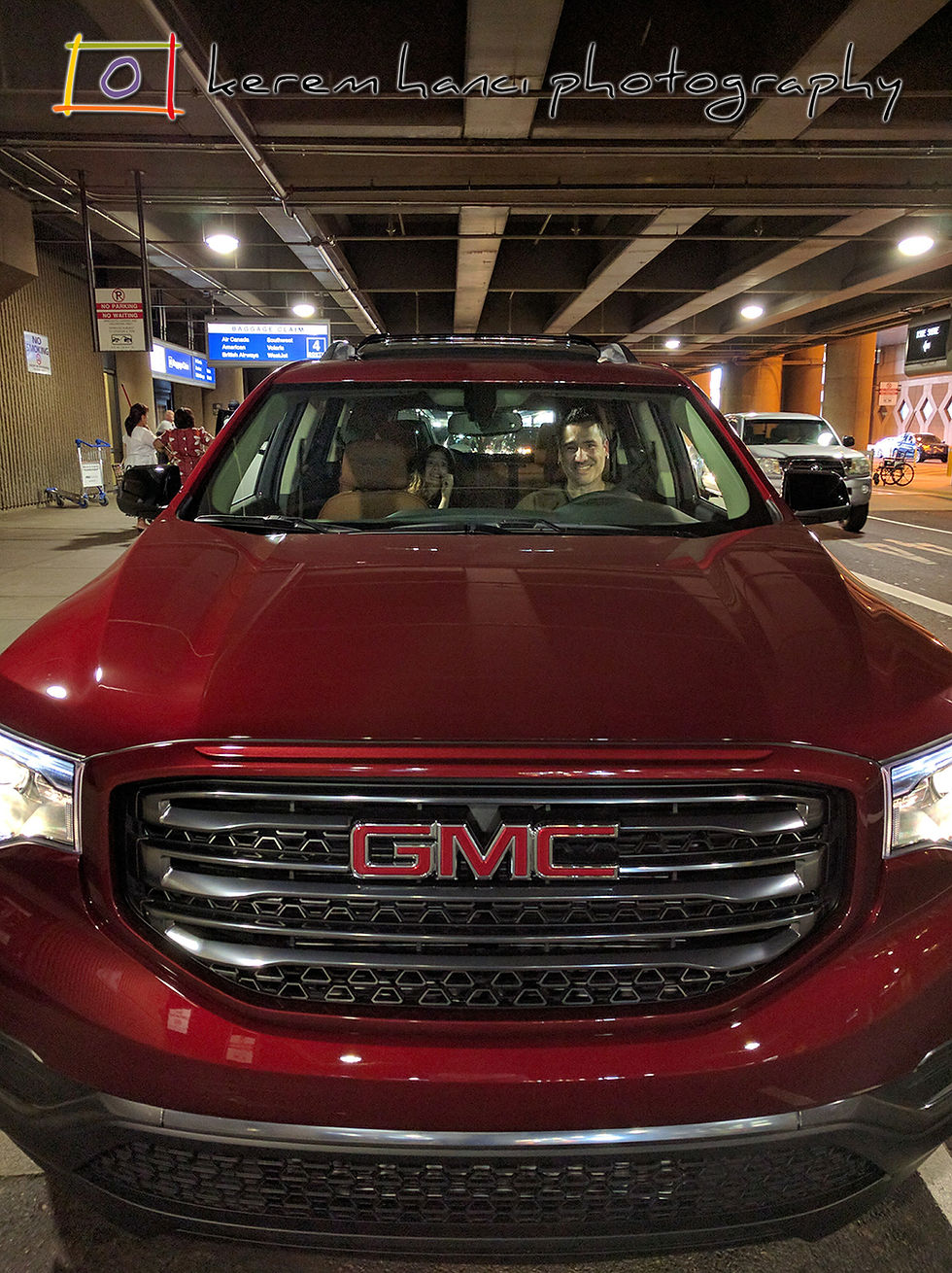 Father & Daughter smiling in a brand new 2018 GMC Acadia