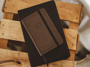 overhead shot notebook bible wooden box