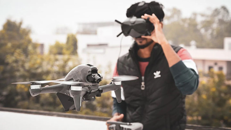 Samruddha Patil flying a drone, focused on controlling the device.
