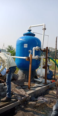 big blue FRP vessel under assembly