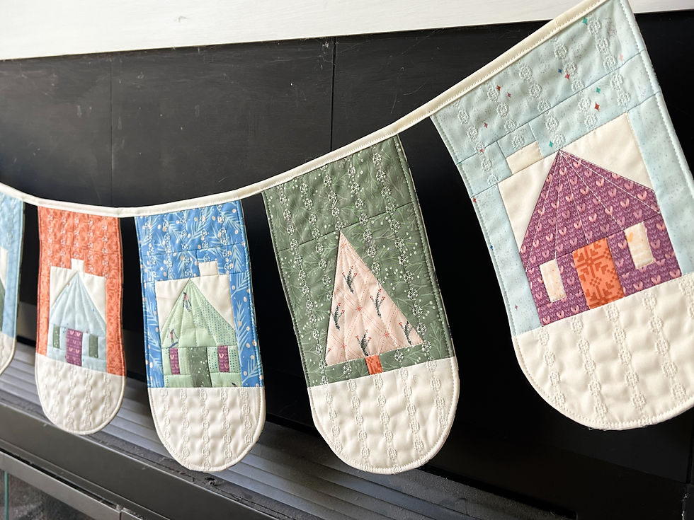 Cozy Home Bunting strung above a fireplace.