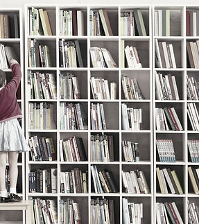 Girl Reaching Books_edited.jpg