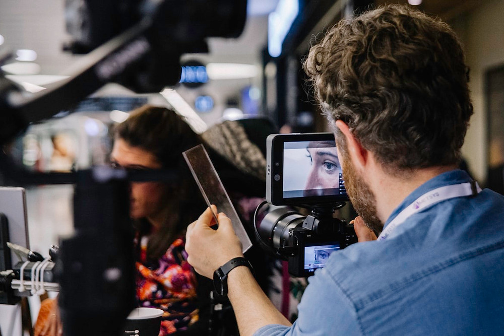 person filming client for an agency video