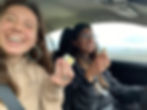 Selfie: Tiff eating a hard-boiled egg and Rachel driving eating a sandwich