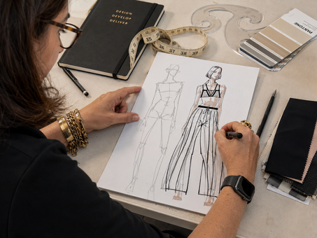 Fashion designer reviewing the fit of a swimsuit during product development, illustrating the importance of wear testing before production to evaluate comfort, performance, and real-world use.