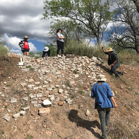 Our hard-working team admires the nearly completed mosaic.