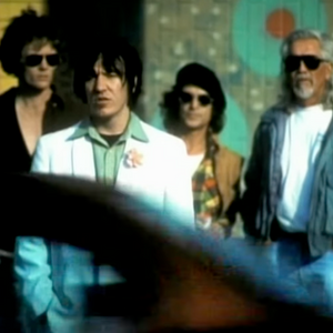 Singer Elliot Smith crossing street in music video "Miss Misery"