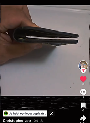 Hand holding a black wallet,