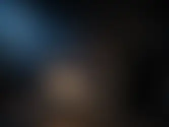 Man kneeling in prayer at 3 AM beside an open Bible illuminated by warm lamplight, moonlight streaming through window, conveying hope in the darkest hour