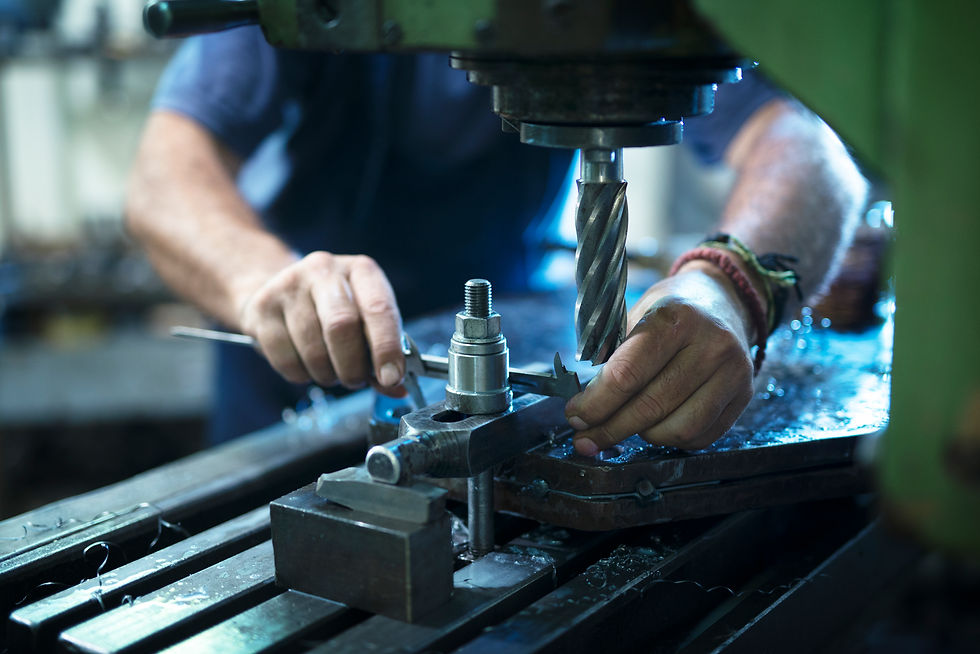 worker-operating-industrial-machine-metal-workshop (1).jpg