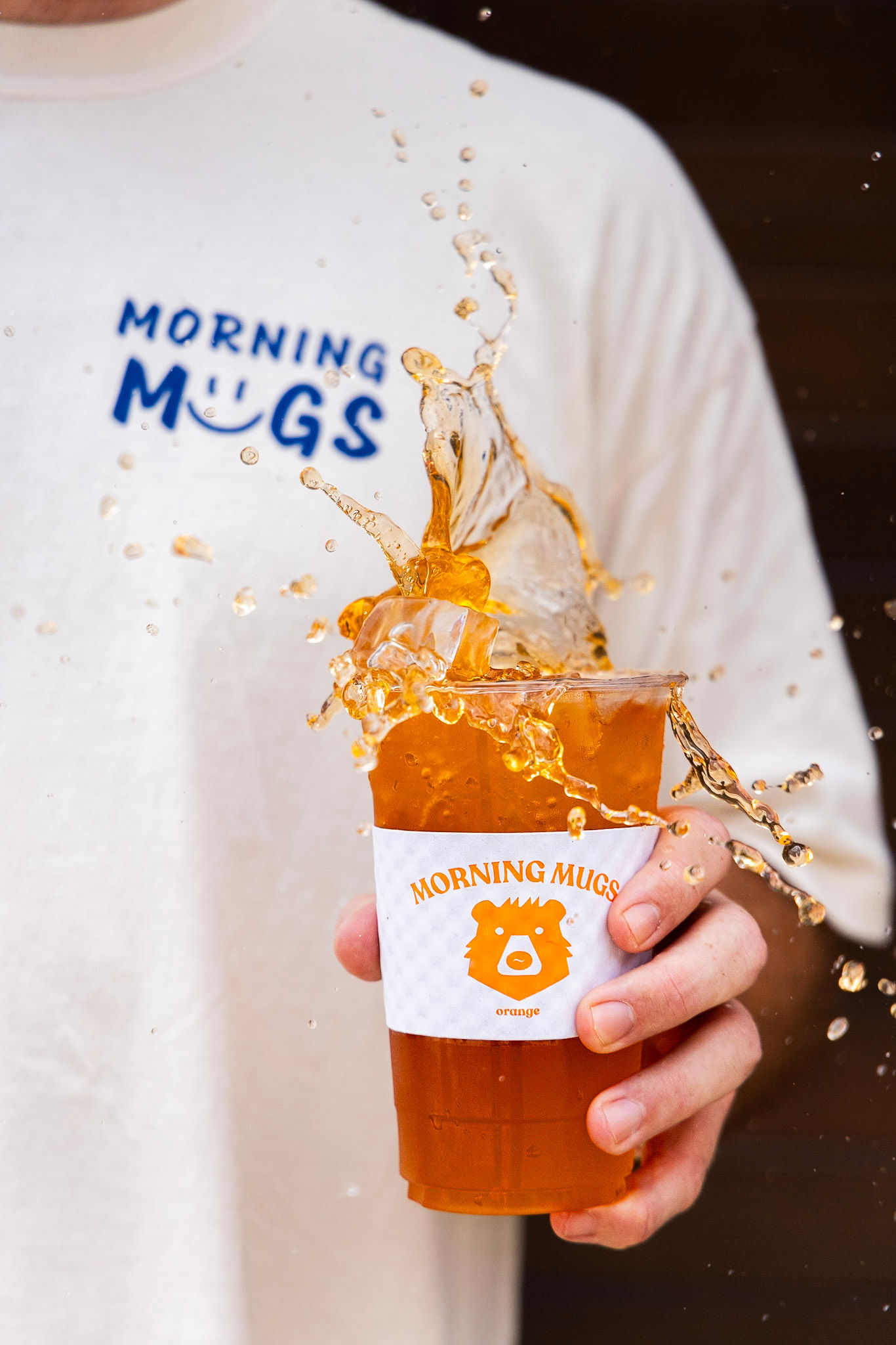 Morning Mugs iced coffee with a colorful bear sleeve