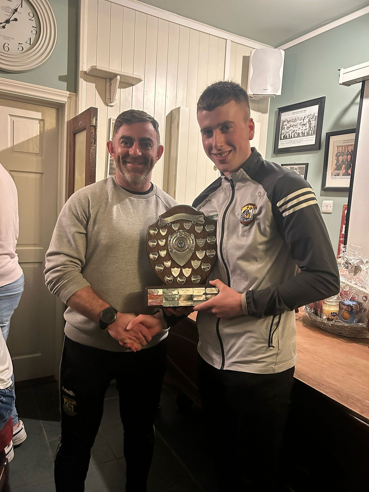 Player of the Year, Colin Hastings, receiving his award from John Reilly