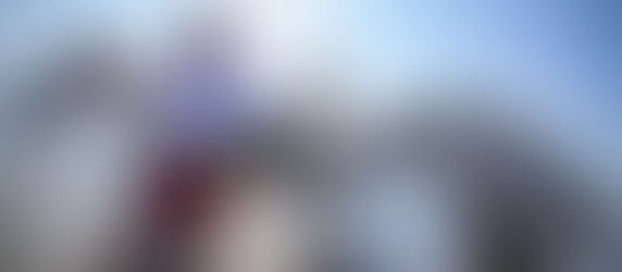 Painter Andrew Manaylo standing among horses, reflecting on 2026 – the Year of the Horse