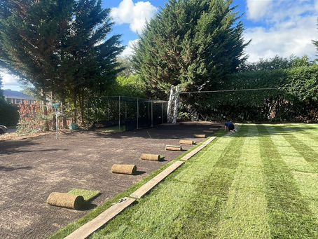 Level, freshly striped new lawn laid by We Lay Lawn Turf in Surrey