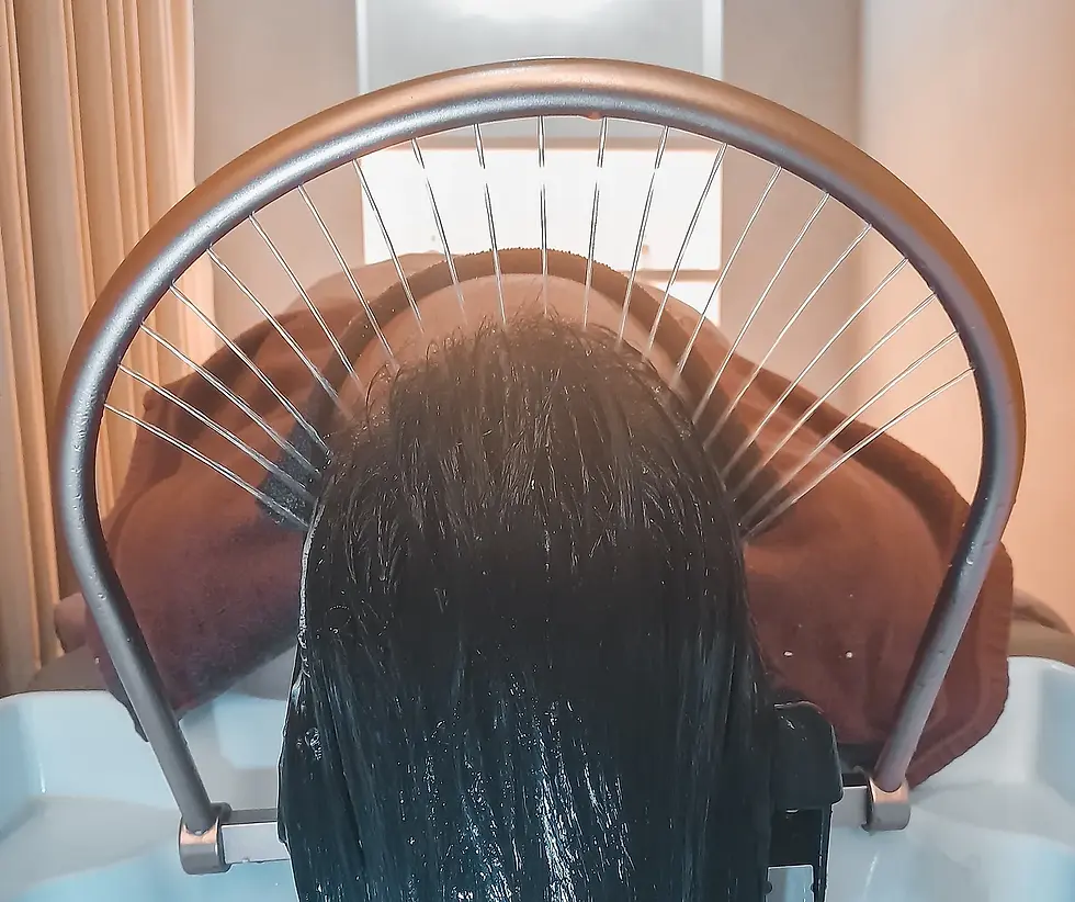 Hair soaked in running water using the japanese head spa method.jpg