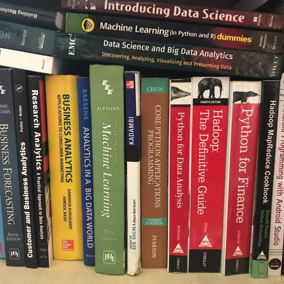Visual of a bookshelf with books related to data science, analytics, and more.