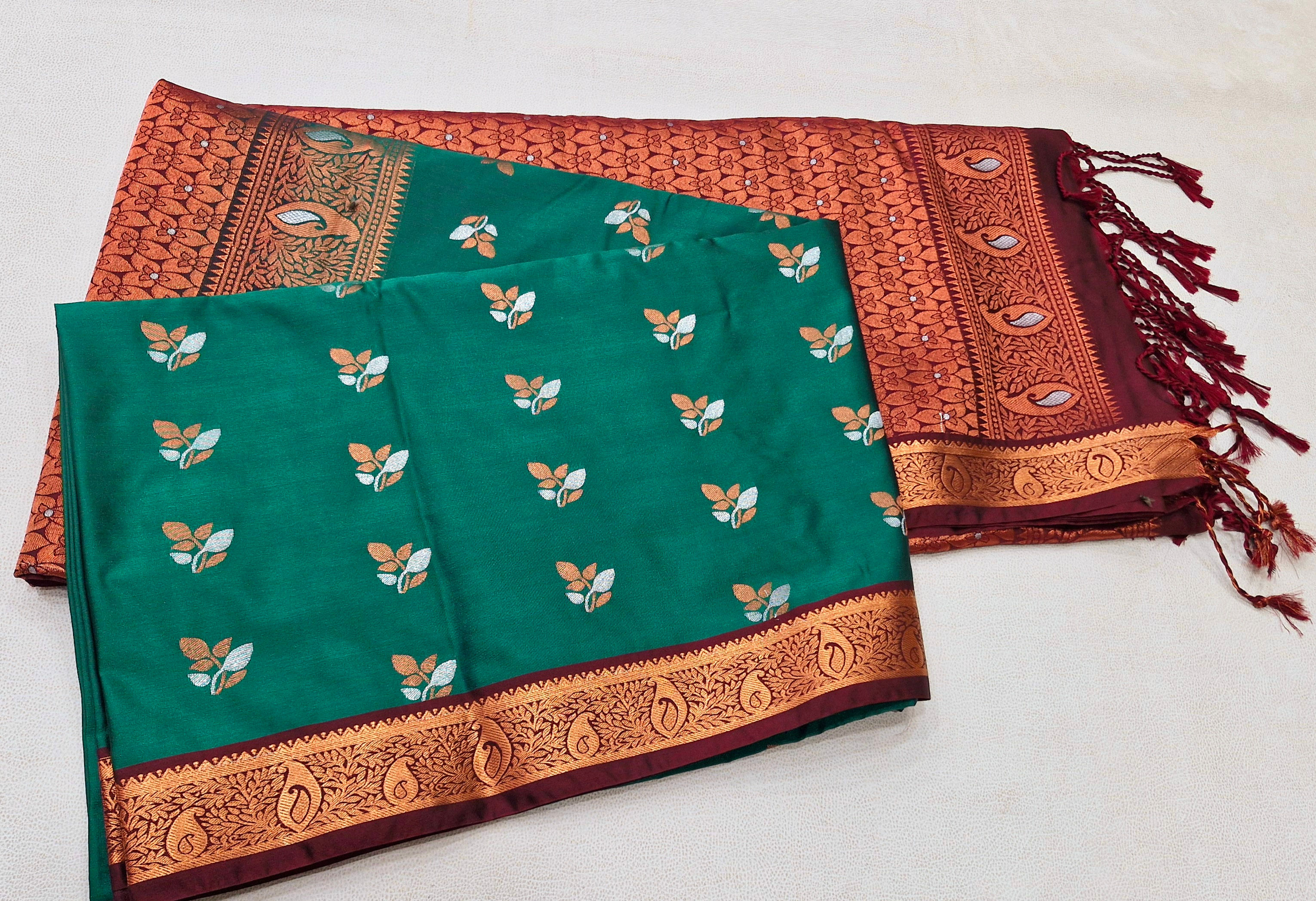 Brown colour with peacock green colour Kanchipuram pattu saree 