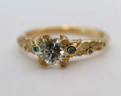 Laurel leaf setting ring with natural blue diamonds