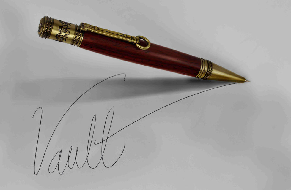 a pen has the word Vault written on a piece of paper