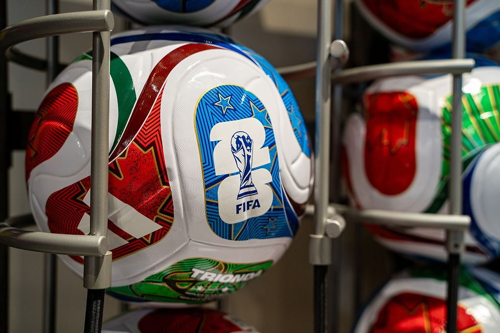 Official FIFA footballs on display, showcasing vibrant designs for an upcoming international tournament.