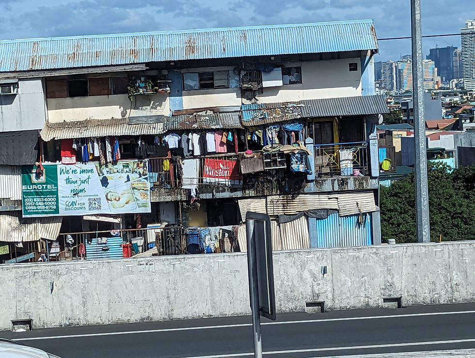 shabby apartment with laundry hanging in Manila